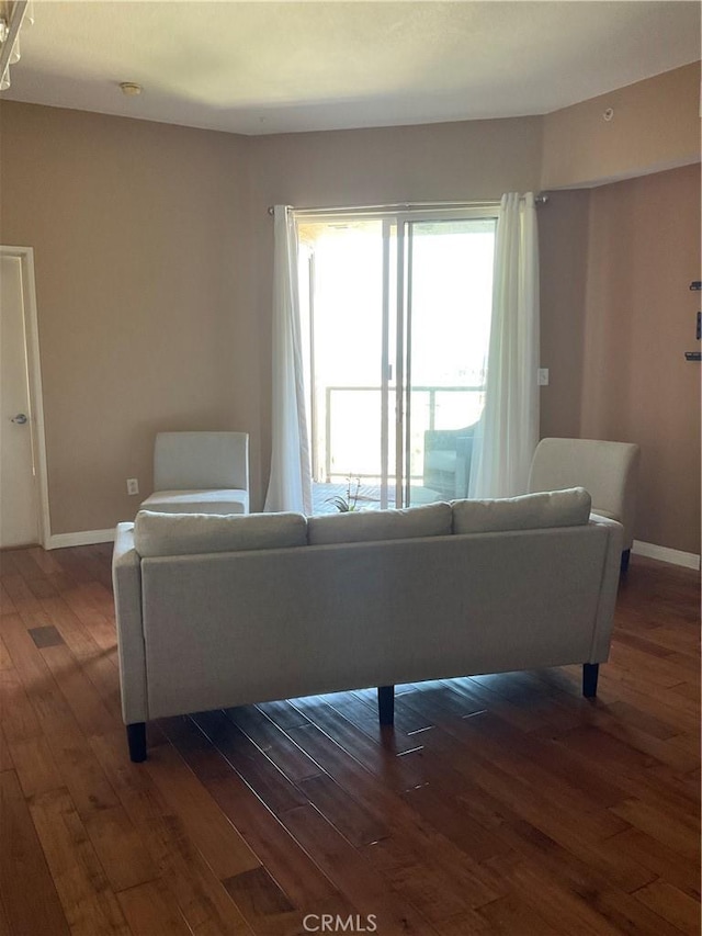 388 E Ocean Blvd Unit 718, Long Beach, CA 90802 - living room featuring dark wood-type flooring and baseboards