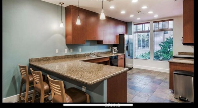 388 E Ocean Blvd Unit 718, Long Beach, CA 90802 - kitchen featuring black dishwasher, recessed lighting, a peninsula, stainless steel refrigerator with ice dispenser, and pendant lighting