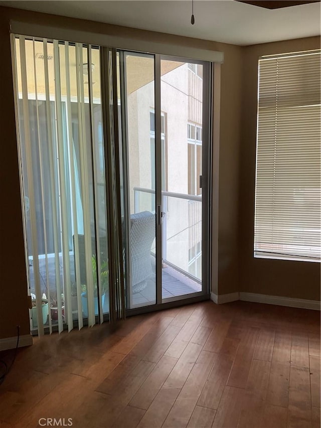 388 E Ocean Blvd Unit 718, Long Beach, CA 90802 - empty room featuring wood-type flooring and plenty of natural light