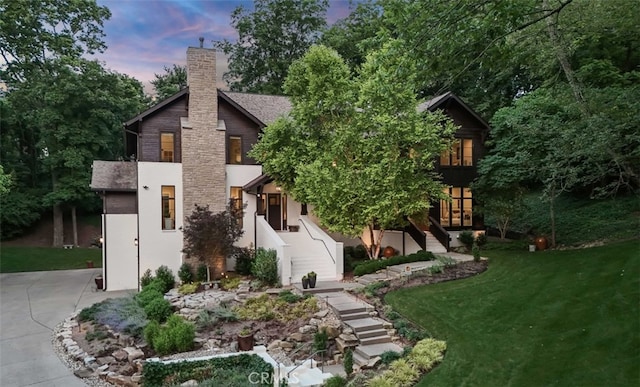 3530 Trimble Ct, Nashville, TN 37215 - view of front of house with stairs, a chimney, a yard, and stucco siding