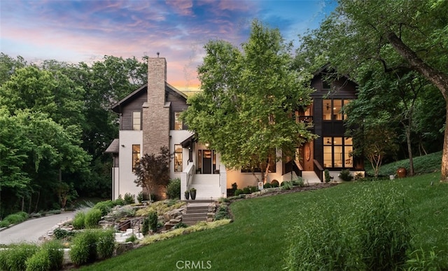 3530 Trimble Ct, Nashville, TN 37215 - view of front facade featuring a front yard, a chimney, and stucco siding