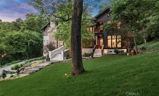 3530 Trimble Ct, Nashville, TN 37215 - back of house at dusk with a balcony, a lawn, crawl space, and stairway