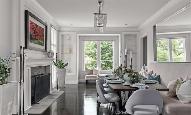 3530 Trimble Ct, Nashville, TN 37215 - dining area featuring healthy amount of natural light, a fireplace with raised hearth, ornamental molding, and dark wood-style flooring