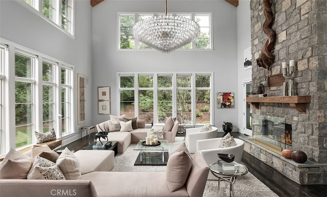 3530 Trimble Ct, Nashville, TN 37215 - living area with high vaulted ceiling, a stone fireplace, plenty of natural light, wood finished floors, and a chandelier