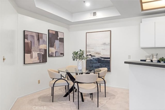 3561 Clarington Ave Unit 310, Los Angeles, CA 90034 - dining room featuring a raised ceiling and light colored carpet