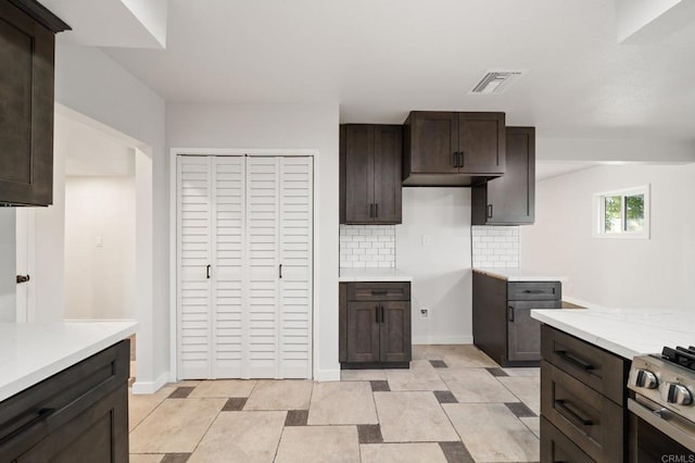 11233 Mountain, Riverside, CA 92505 - kitchen featuring light countertops, dark brown cabinets, decorative backsplash, and gas range