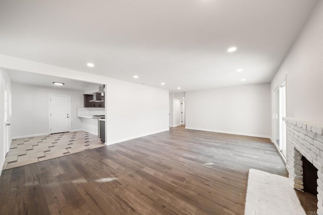 11233 Mountain, Riverside, CA 92505 - unfurnished living room with light wood-style flooring, a fireplace, and recessed lighting