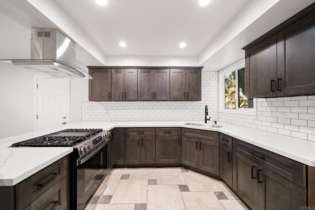 11233 Mountain, Riverside, CA 92505 - kitchen featuring gas stove, island range hood, dark brown cabinetry, recessed lighting, and backsplash