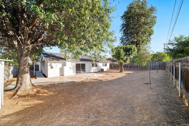 11233 Mountain, Riverside, CA 92505 - fenced backyard with a patio area