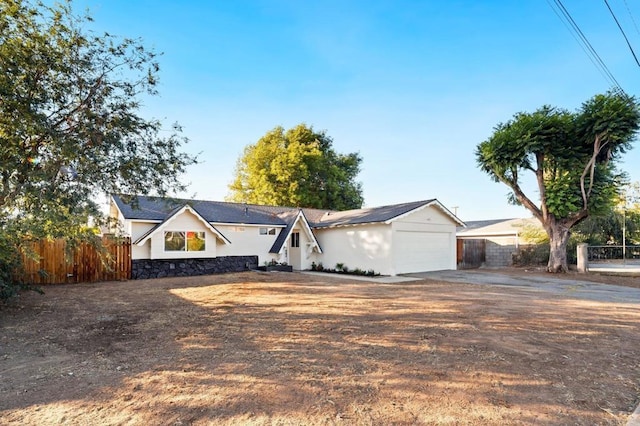 11233 Mountain, Riverside, CA 92505 - view of front of house featuring concrete driveway and stone siding