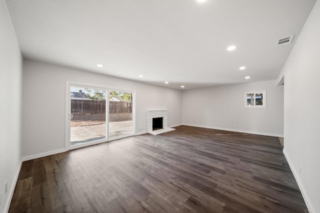 11233 Mountain, Riverside, CA 92505 - unfurnished living room featuring dark wood-style flooring, recessed lighting, and a fireplace