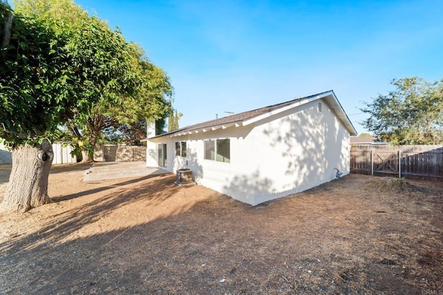 11233 Mountain, Riverside, CA 92505 - rear view of property with a fenced backyard, a patio area, and stucco siding
