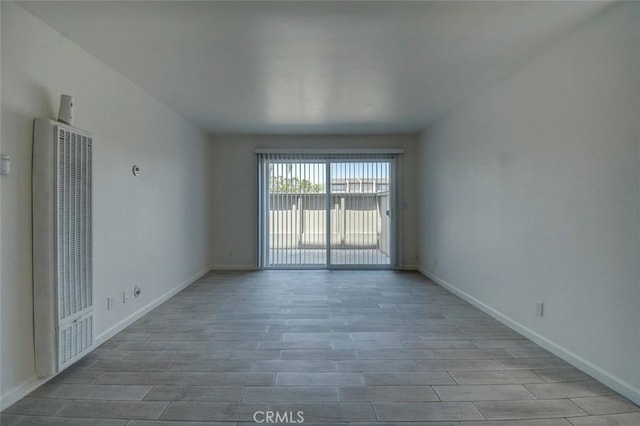 23318 Sesame St Unit E, Torrance, CA 90502 - unfurnished room featuring a heating unit and wood finished floors