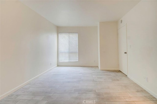 23318 Sesame St Unit E, Torrance, CA 90502 - spare room featuring light wood-type flooring and baseboards