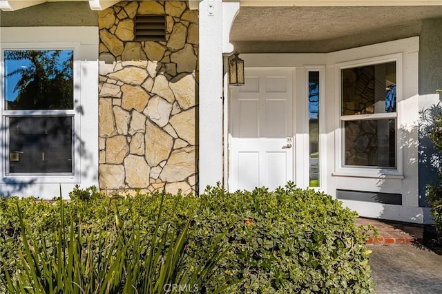 11 Thunder Trl Unit 6, Irvine, CA 92614 - property entrance featuring stone siding