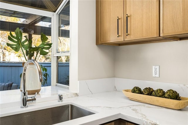 11 Thunder Trl Unit 6, Irvine, CA 92614 - kitchen with a sink and light stone counters