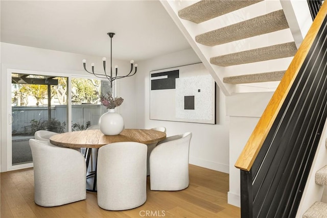 11 Thunder Trl Unit 6, Irvine, CA 92614 - dining room with light wood finished floors and a chandelier