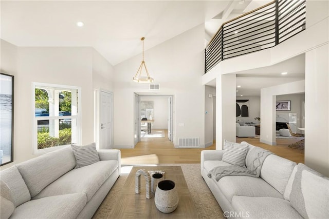 11 Thunder Trl Unit 6, Irvine, CA 92614 - living area with light wood-style floors, high vaulted ceiling, and recessed lighting