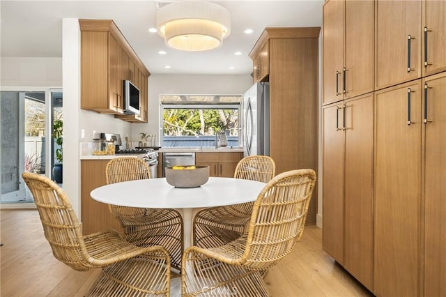 11 Thunder Trl Unit 6, Irvine, CA 92614 - dining space with light wood-style floors and recessed lighting