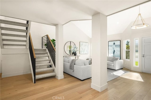 11 Thunder Trl Unit 6, Irvine, CA 92614 - foyer with stairway, light wood finished floors, and lofted ceiling