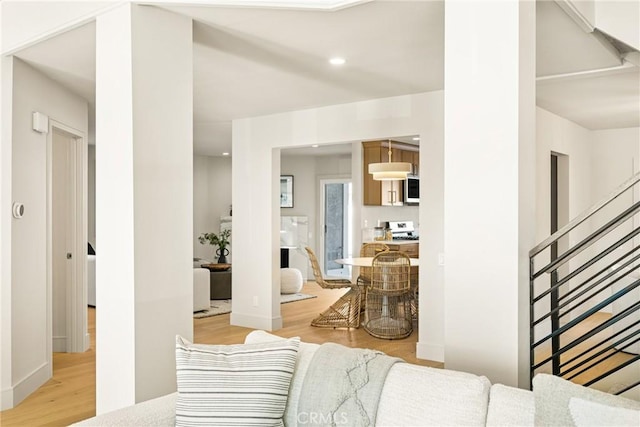 11 Thunder Trl Unit 6, Irvine, CA 92614 - living area featuring light wood-type flooring, stairs, and recessed lighting
