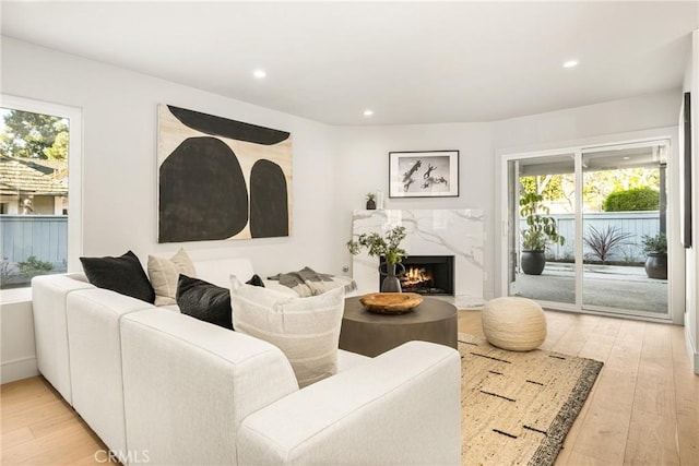 11 Thunder Trl Unit 6, Irvine, CA 92614 - living area featuring light wood-style floors, recessed lighting, and a high end fireplace