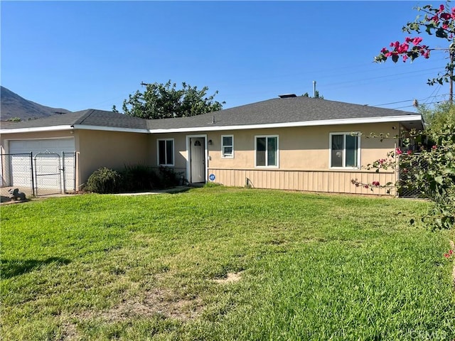 5617 29th St, Jurupa Valley, CA 92509 - ranch-style house featuring a front yard, a garage, a gate, and stucco siding