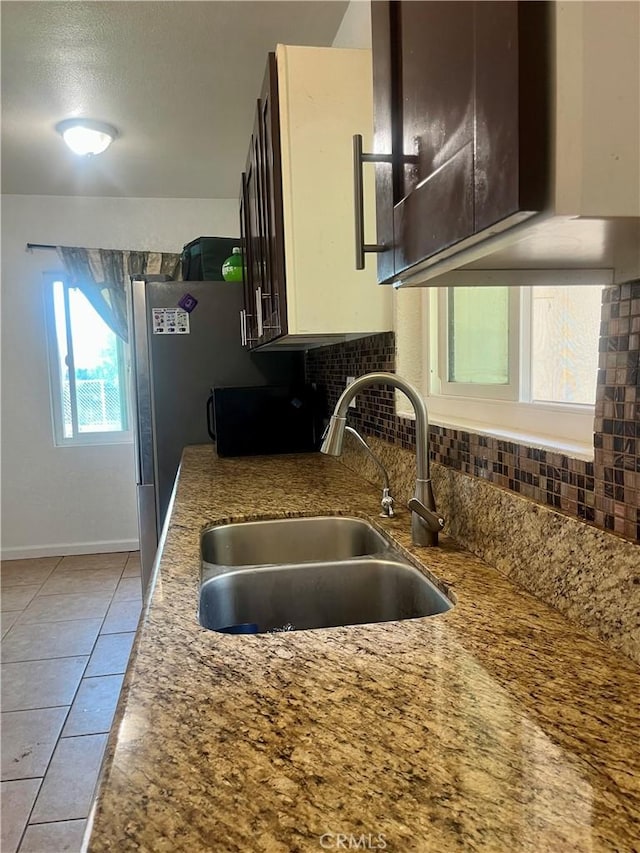 5617 29th St, Jurupa Valley, CA 92509 - kitchen with tasteful backsplash, light tile patterned floors, and a textured ceiling
