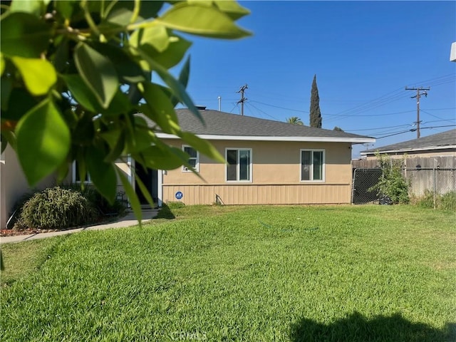 5617 29th St, Jurupa Valley, CA 92509 - view of side of property featuring stucco siding and roof with shingles