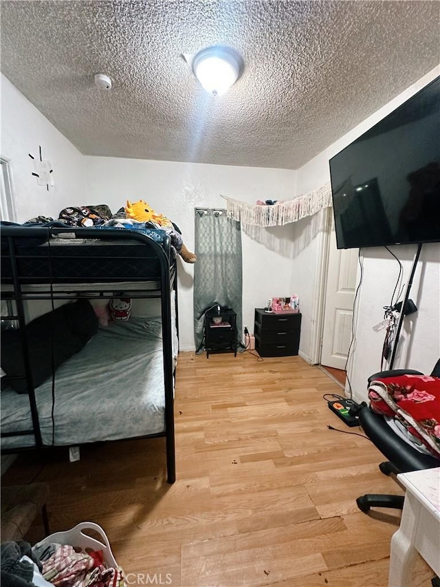 3747 Mintern St, Jurupa Valley, CA 92509 - bedroom with a textured ceiling and light wood finished floors