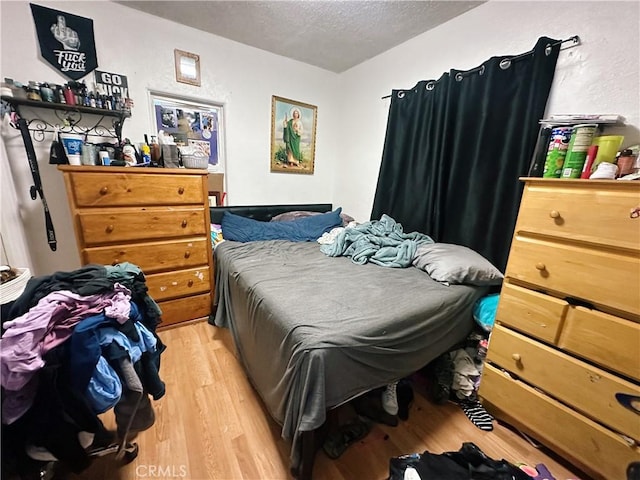 3747 Mintern St, Jurupa Valley, CA 92509 - bedroom with a textured ceiling and light wood-type flooring