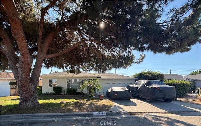 15515 Harvest Ave, Norwalk, CA 90650 - ranch-style house with an attached garage and concrete driveway