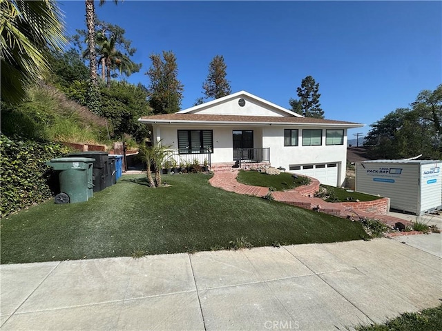 906 Groton Dr, Burbank, CA 91504 - view of front of home featuring stucco siding, a porch, an attached garage, a front yard, and driveway