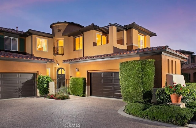 7 Suprema Dr, Newport Coast, CA 92657 - mediterranean / spanish-style house with a garage, concrete driveway, a tile roof, and stucco siding