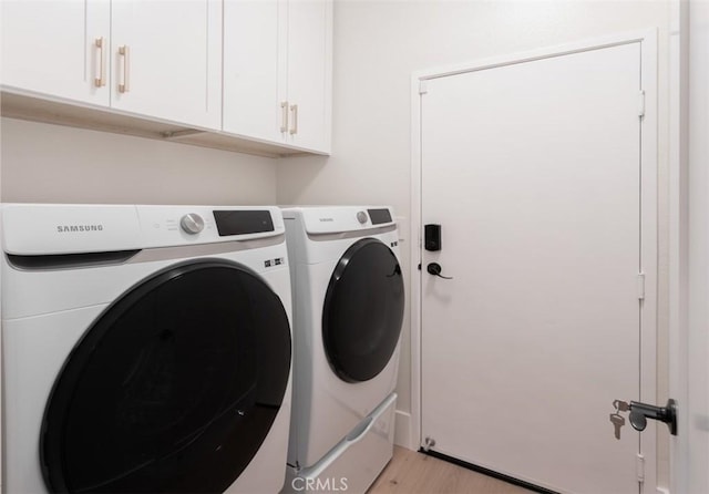 7 Suprema Dr, Newport Coast, CA 92657 - laundry room featuring cabinet space, washer and dryer, and light wood-type flooring