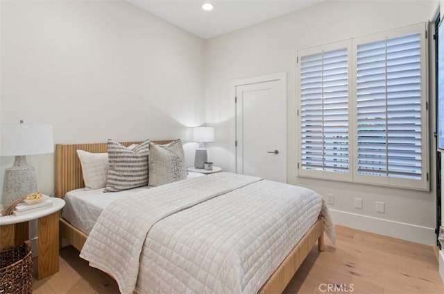 7 Suprema Dr, Newport Coast, CA 92657 - bedroom with light wood-style flooring and recessed lighting