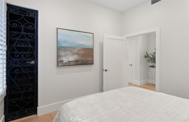 7 Suprema Dr, Newport Coast, CA 92657 - bedroom with wood finished floors and baseboards