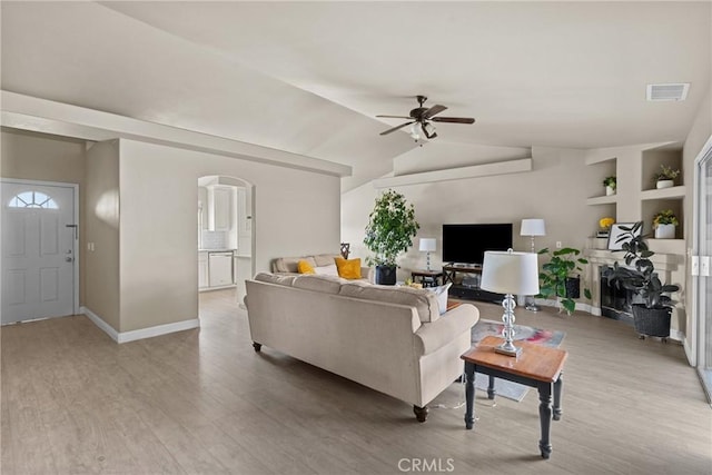 825 Rosana Pl, Nipomo, CA 93444 - living area with a ceiling fan, light wood finished floors, arched walkways, and lofted ceiling