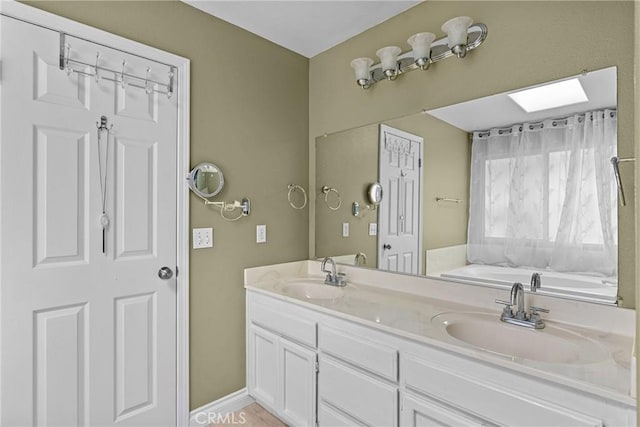 825 Rosana Pl, Nipomo, CA 93444 - bathroom with a bath, double vanity, and a skylight