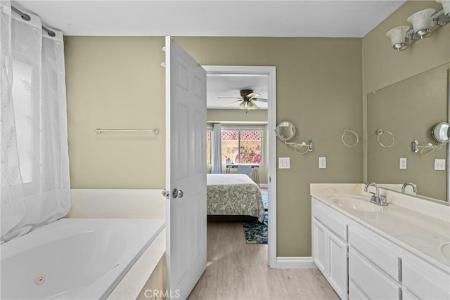 825 Rosana Pl, Nipomo, CA 93444 - full bath with connected bathroom, a tub with jets, a ceiling fan, wood finished floors, and double vanity