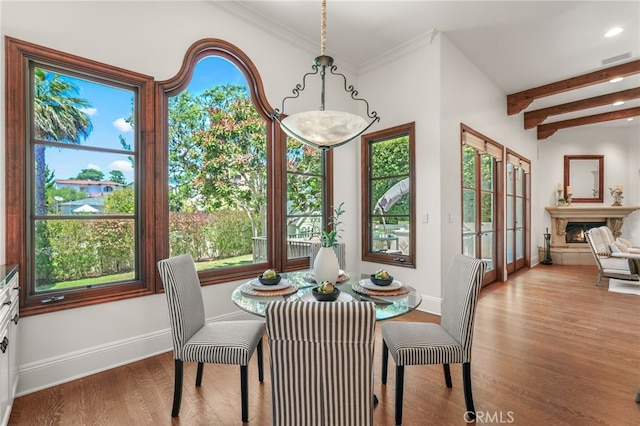 1337 8th St, Manhattan Beach, CA 90266 - dining area with wood finished floors, healthy amount of natural light, beamed ceiling, recessed lighting, and a warm lit fireplace