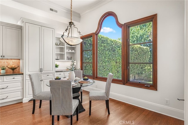 1337 8th St, Manhattan Beach, CA 90266 - dining area with wood finished floors and crown molding