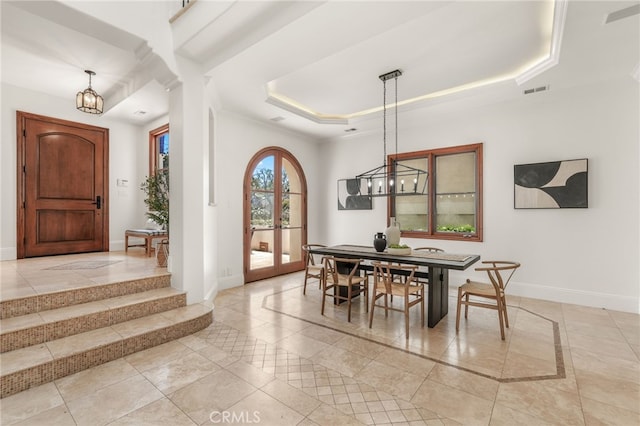 1337 8th St, Manhattan Beach, CA 90266 - dining area with inlaid floor details, a chandelier, and a tray ceiling