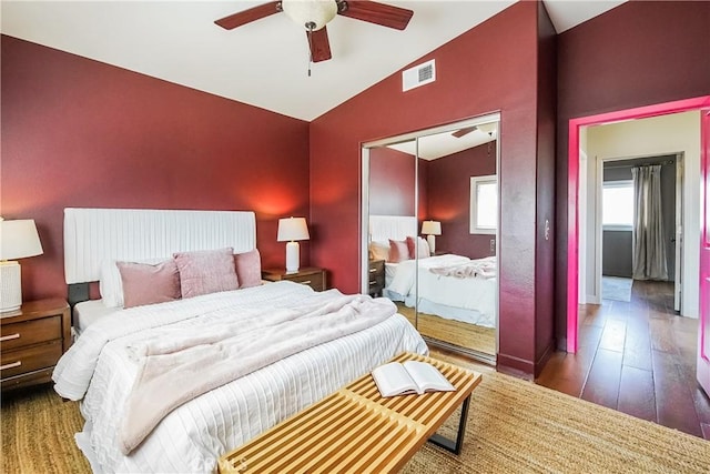 1002 Leighton Ave, Los Angeles, CA 90037 - bedroom featuring vaulted ceiling, a closet, hardwood / wood-style flooring, and ceiling fan