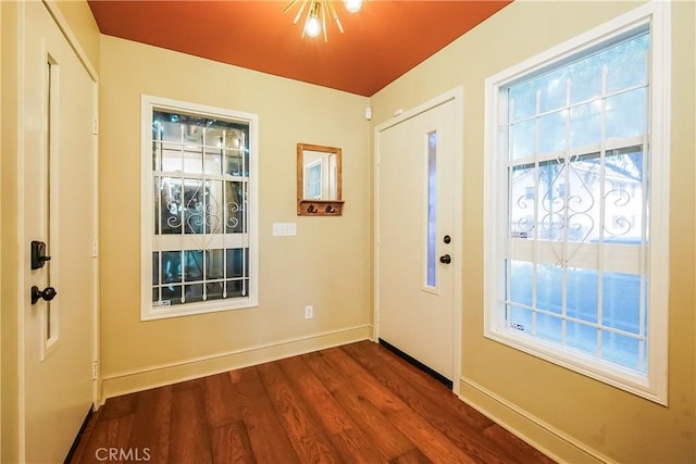 1002 Leighton Ave, Los Angeles, CA 90037 - foyer entrance with baseboards and dark wood-style flooring