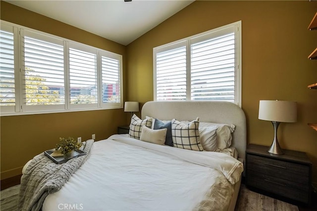 1002 Leighton Ave, Los Angeles, CA 90037 - bedroom featuring lofted ceiling and wood finished floors