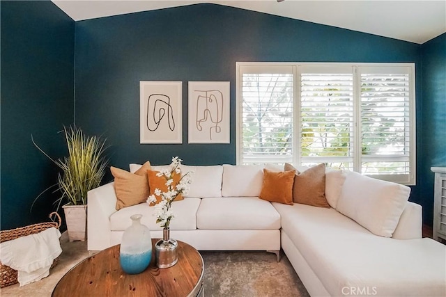 1002 Leighton Ave, Los Angeles, CA 90037 - carpeted living room featuring lofted ceiling and plenty of natural light