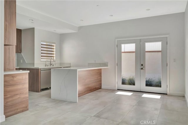6943 Goodland Ave, North Hollywood, CA 91605 - kitchen featuring modern cabinets, stainless steel dishwasher, french doors, and light countertops