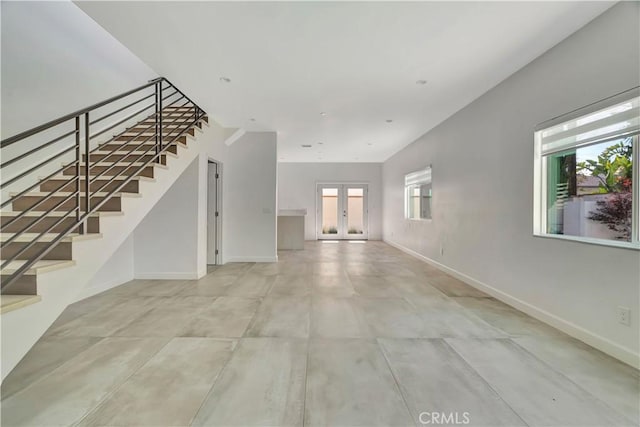 6943 Goodland Ave, North Hollywood, CA 91605 - unfurnished living room featuring stairway and french doors
