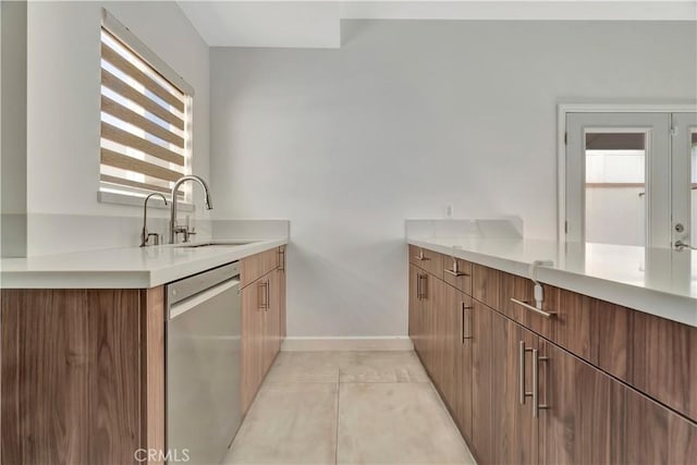 6943 Goodland Ave, North Hollywood, CA 91605 - kitchen with dishwasher, plenty of natural light, light countertops, and light tile patterned floors
